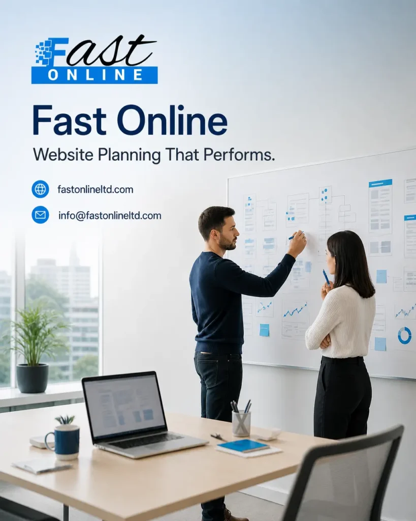 Modern office workspace with developers using a laptop to review website design and SEO planning.